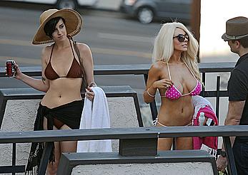 Busty Courtney Stodden getting close with a girlfriend whilst laying poolside