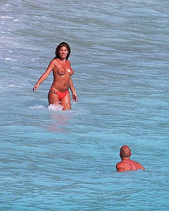 Daisy Fuentes topless on a beach paparazzi photos