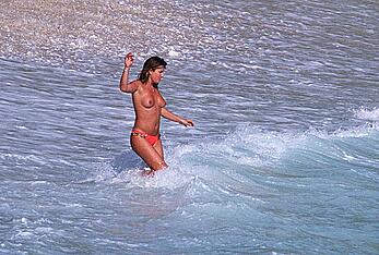 Daisy Fuentes topless on a beach paparazzi photos