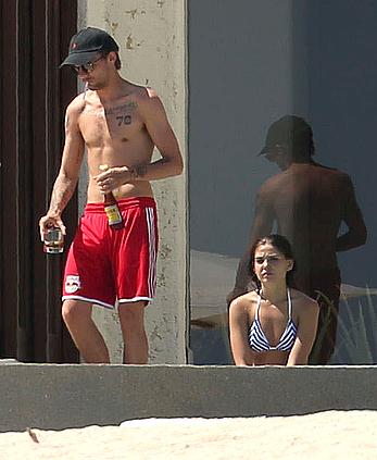 Danielle Campbell toless at a pool in Cabo San Lucas