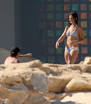 Danielle Campbell toless at a pool in Cabo San Lucas