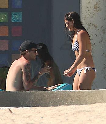 Danielle Campbell toless at a pool in Cabo San Lucas