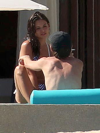 Danielle Campbell toless at a pool in Cabo San Lucas