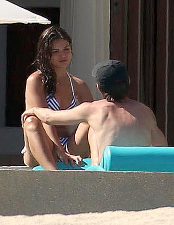 Danielle Campbell toless at a pool in Cabo San Lucas