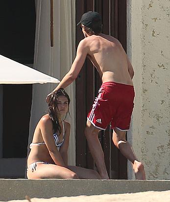 Danielle Campbell toless at a pool in Cabo San Lucas