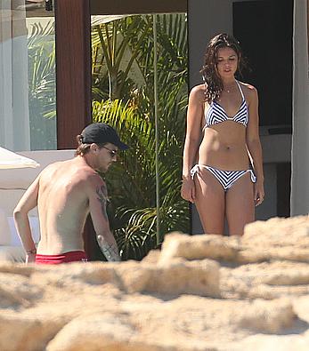 Danielle Campbell toless at a pool in Cabo San Lucas