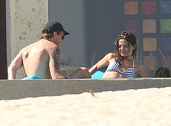 Danielle Campbell toless at a pool in Cabo San Lucas