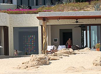 Danielle Campbell toless at a pool in Cabo San Lucas