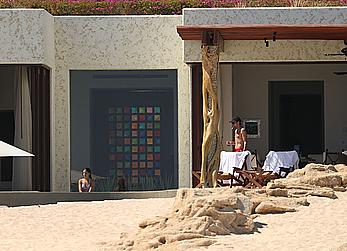 Danielle Campbell toless at a pool in Cabo San Lucas