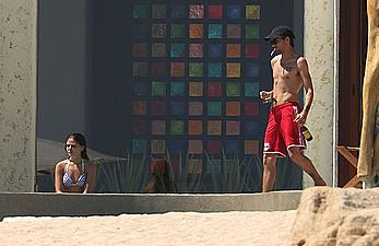 Danielle Campbell toless at a pool in Cabo San Lucas