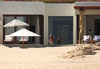 Danielle Campbell toless at a pool in Cabo San Lucas