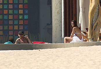 Danielle Campbell toless at a pool in Cabo San Lucas