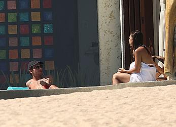 Danielle Campbell toless at a pool in Cabo San Lucas