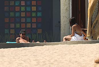 Danielle Campbell toless at a pool in Cabo San Lucas