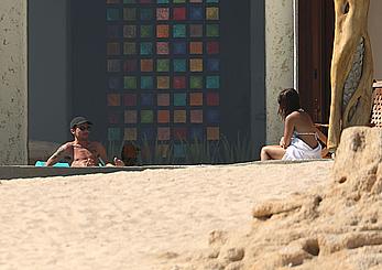 Danielle Campbell toless at a pool in Cabo San Lucas