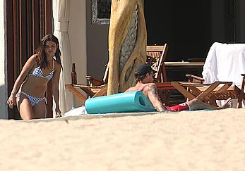 Danielle Campbell toless at a pool in Cabo San Lucas