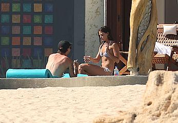 Danielle Campbell toless at a pool in Cabo San Lucas