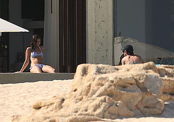 Danielle Campbell toless at a pool in Cabo San Lucas