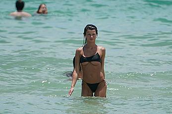 Destiny Sierra bottom of boobs in a tiny black bikini at the beach in Miami Beach