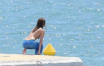 Doria Tillier topless in a mermaid costume at Cannes Film Festival