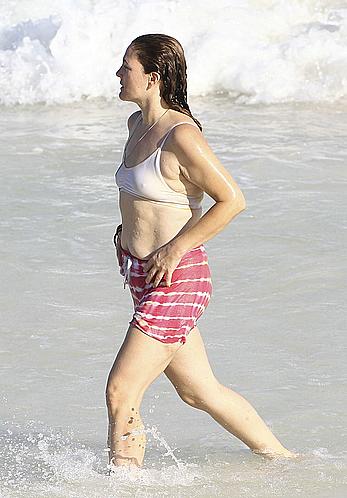 Drew Barrymore pokies in wet top at a beach in Miami