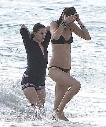 Drew Barrymore pokies in wet top at a beach in Miami