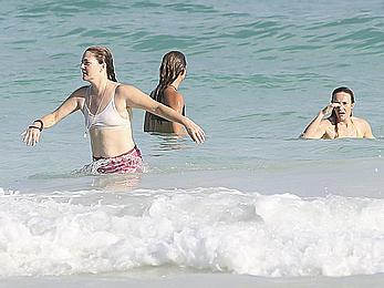 Drew Barrymore pokies in wet top at a beach in Miami