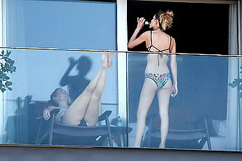 Dylan Penn topless at her hotel balcony