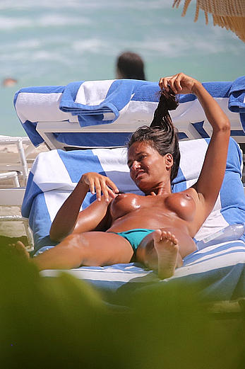 Eda Taspinar sunbathing topless