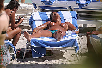 Eda Taspinar sunbathing topless