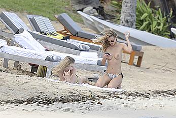 Edita Vilkeviciute sunbathing topless in St Barts