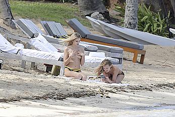 Edita Vilkeviciute sunbathing topless in St Barts