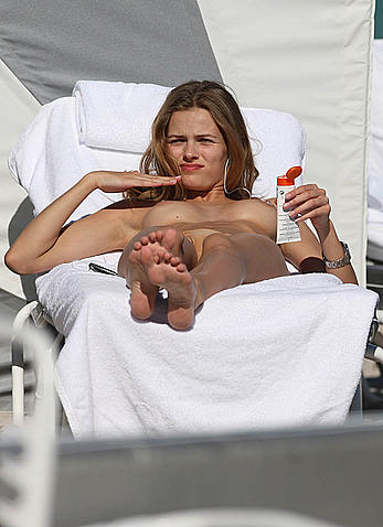 Edita Vilkeviciute caught topless on a beach