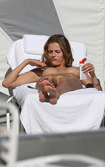 Edita Vilkeviciute caught topless on a beach