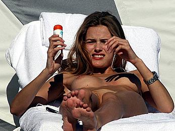 Edita Vilkeviciute caught topless on a beach