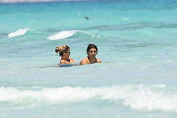 Elena Santarelli topless on the beach candids