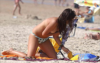 Elena Furiase in bikini and topless on a beach paparazzi photos