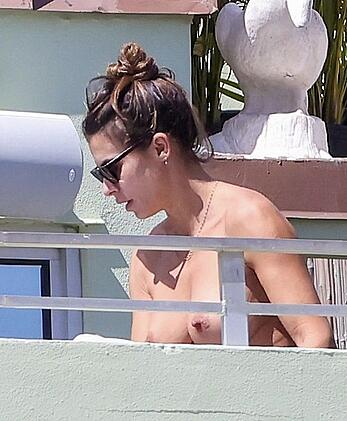 Elisabetta Canalis topless at on a balkony in Miami