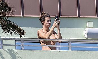 Elisabetta Canalis topless at on a balkony in Miami