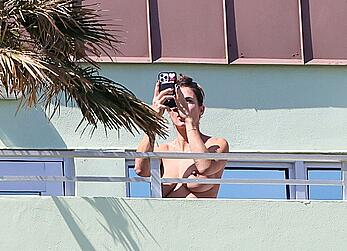 Elisabetta Canalis topless at on a balkony in Miami