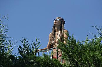 Elisabetta Gregoraci caught topless on a balcony in Porto Cervo