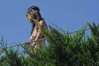 Elisabetta Gregoraci caught topless on a balcony in Porto Cervo