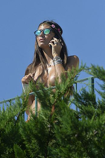 Elisabetta Gregoraci caught topless on a balcony in Porto Cervo