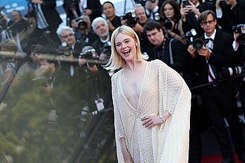 Elle Fanning in see through dress at closing ceremony red carpet of the 77th annual Cannes Film Festival