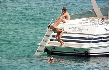 Elle Macpherson topless on a yacht