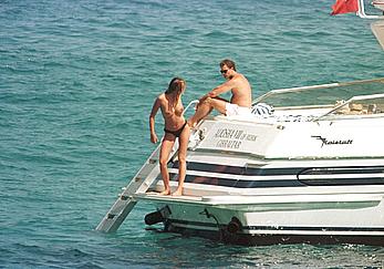 Elle Macpherson topless on a yacht