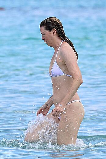 Ellen Pompeo in wet see through bikini at the beach in Sardinia