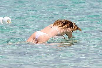 Ellen Pompeo in wet see through bikini at the beach in Sardinia