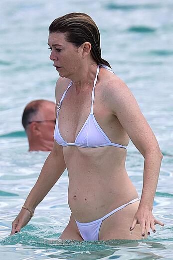 Ellen Pompeo in wet see through bikini at the beach in Sardinia