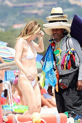 Ellen Pompeo in wet see through bikini at the beach in Sardinia